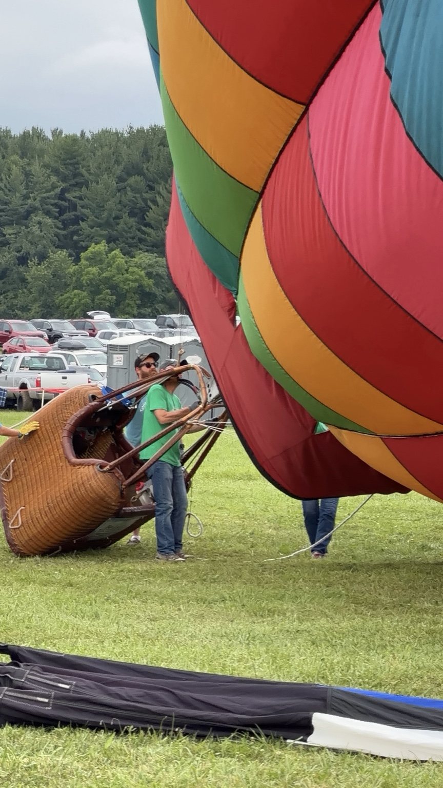 Crew righting a balloon basket during inflation