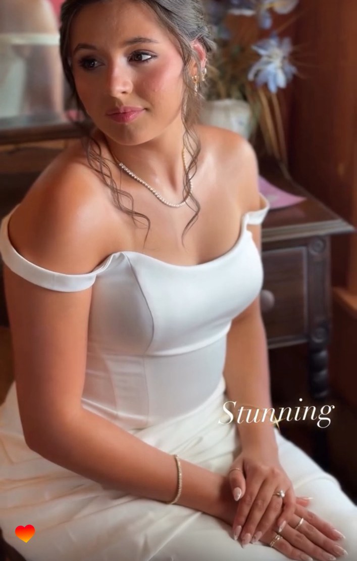 Bride seated in her dress before the ceremony
